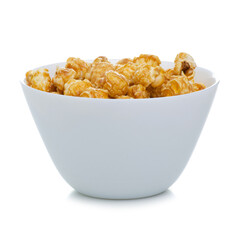 White bowl with caramel sweet popcorn on white background isolation