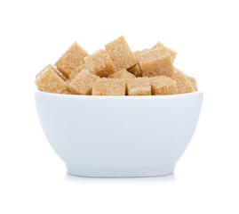 White bowl with cane brown sugar cubes on white background isolation