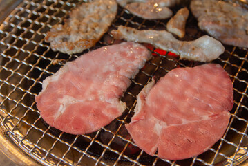 Raw beef on grille for barbecue Japanese style or yakiniku