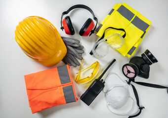 Work safety protection equipment background. Industrial protective gear on white