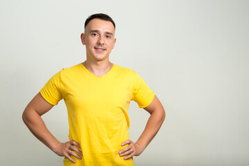 Portrait of handsome man with yellow shirt