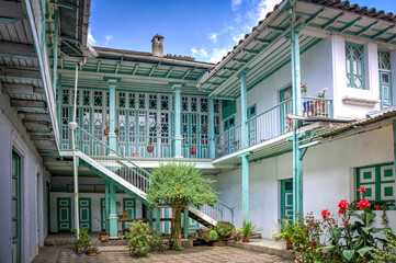Guaranda, Bolivar province, Ecuador - November, 2013: An old colonial and traditional house, with many doors, hallways, windows, balconies and interior patios.
