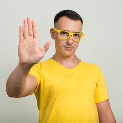 Portrait of handsome man with yellow shirt