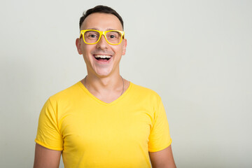 Portrait of handsome man with yellow shirt