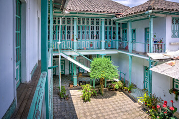 Guaranda, Bolivar province, Ecuador - November, 2013: An old colonial and traditional house, with many doors, hallways, windows, balconies and interior patios.
