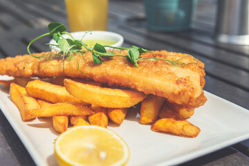 Traditional English Food such as Fish and Chips with green mushy peas served in the Pub or Restaurant