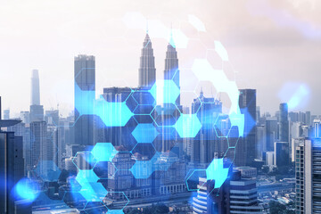 Abstract technology icons hologram over panorama city view of Kuala Lumpur, Malaysia, Asia. The concept of people networking and connections. Double exposure.