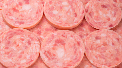 Boiled sausage isolated on white background. Slices.