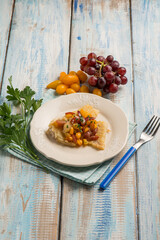 fried cod fish with tomatoes and grape