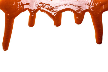 Background of flowing caramel sauce isolated on white.
