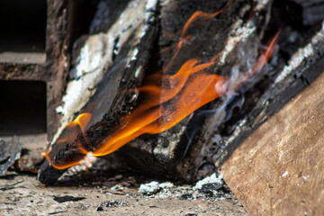 The birch coals burn with a bright flame