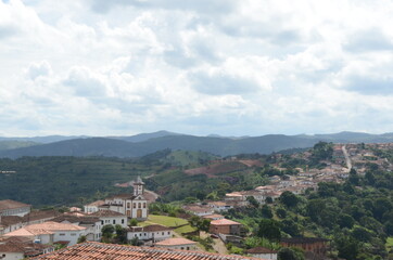 Fototapeta premium View of Serro/MG with Chapel of Santa Rita with blue sky in a cloud day