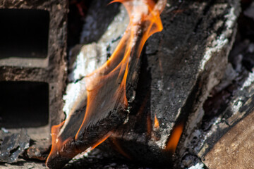 The birch coals burn with a bright flame