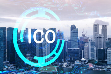 ICO icon hologram over panorama city view of Singapore, the hub of blockchain projects in Asia. The concept of initial coin offering. Double exposure.