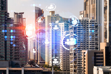 Social media icons hologram over panorama city view of Bangkok, Asia. The concept of people networking and connections. Double exposure.