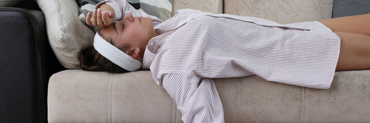 Tired from cleaning girl lies at home on couch. Seasonal spring cleaning house renovation. Wipe...