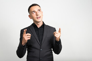 Portrait of handsome businessman in suit against white background