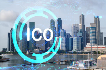 ICO icon hologram over panorama city view of Singapore, the hub of blockchain projects in Asia. The...