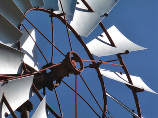 Windmill, detail of the blades on intense blue sky
