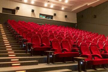 Empty cinema with red-black rows of seats - 369769897