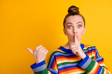 Photo of shocked girl point index finger copyspace indicate voiceless speechless ads promo ask dont share private news put hand mouth wear jumper isolated over shine color background