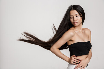Fototapeta premium Beauty portrait of young asian woman with long dark hair