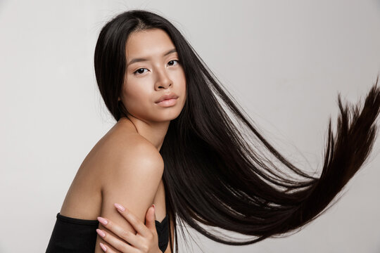 Beauty portrait of young asian woman with long dark hair