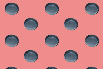 Seamless pattern of Round metal cake pan, tin for baking cakes and cookies. Black collapsible stainless steel round cooking empty pan for cupcakes on peach background