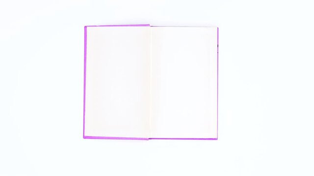 Light purple book appear and open. Stop motion 
