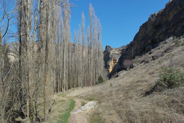Nice path that runs through a canyon on a beautiful sunny winter day with a spectacular deep blue sky. Sickles of the Duratón river, Segovia, Spain
