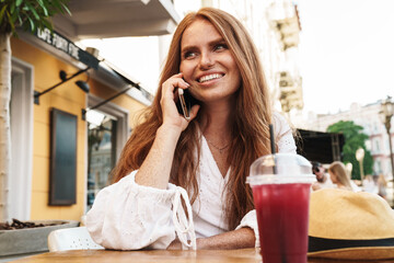 Close up of beautiful smiling red haired woman