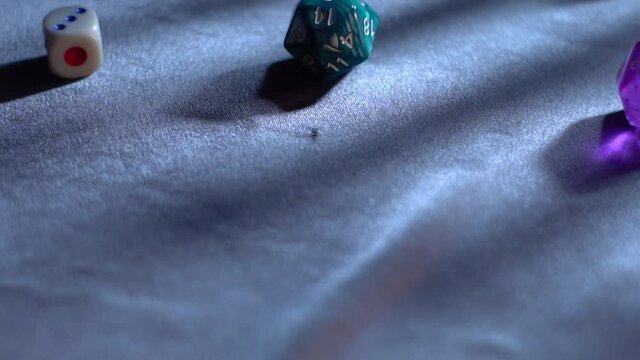 Different types of dice rolling in slow motion