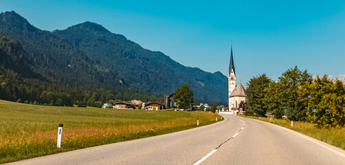 Beautiful alpine view with church Saint Leonhard near Kundl, Tyrol, Austria