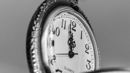 fob watch close up at 12 o'clock