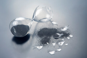 broken hourglass. waste of time. end of opportunity. stop measuring hours. shards of glass....