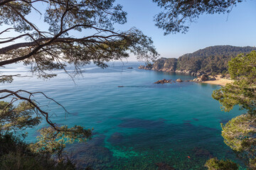 Fototapeta na wymiar View of the picturesque bay. Azure water with boats and hidden beaches. Blanes. Costa Brava. Catalonia. Spain.