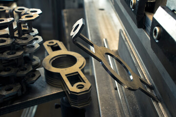 Workpieces cut on a laser machine are bent on a bending machine at the factory.