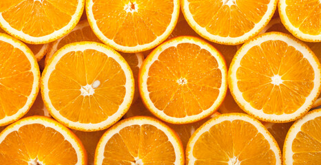 Background from fresh orange slices. Panorama. Banner.	