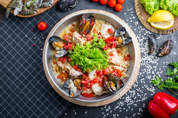 Risotto with seafood. Ready dish of Mussels and shrimps with rice
