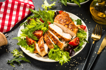 Grilled chicken with fresh salad at black.