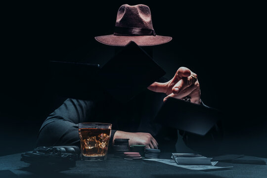 Gngster in hat playing poker and throwing cards.