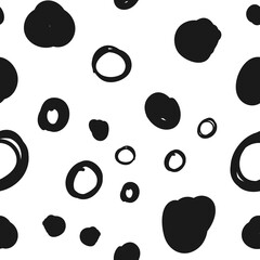 Doodle circles seamless pattern. Black dots texture background.