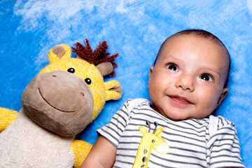 Cute 3 months old baby smiling.