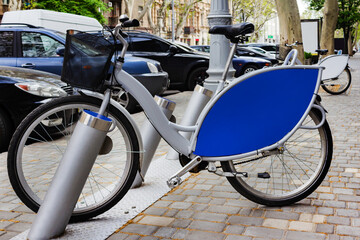 Obraz premium Street rent bicycle on a parking lot.