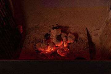 Red hot coals burning in bbq fire place