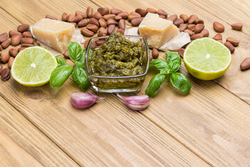 Ingredients for homemade pesto: basil leaves, parmesan, pine nuts, garlic, half lemon.