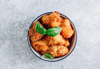 Popular Baked Cauliflower with barbeque sauce. Buffalo barbecue Cauliflower Wings. Vegan Food concept.
