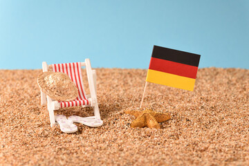 Sunbed on the beach with German flag.