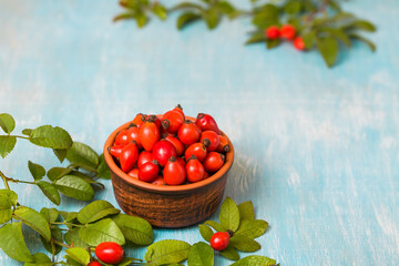 Rose hip. Fresh vitamins on wooden table. 
Healthy eating