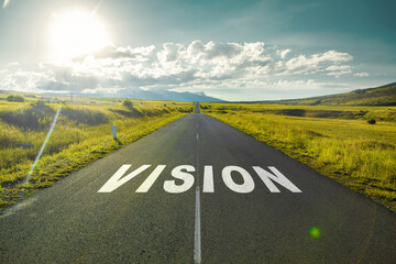 vision text on asphalt road